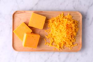 1 serving (1 oz) Mild Cheddar Cheese