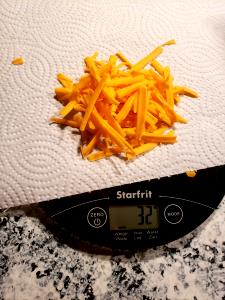 1 serving (28 g) Shredded Cheese