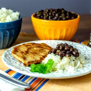 1 Serving Pork Tropichop With Rice And Black Beans