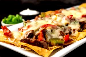 1 serving Steak Fajita Nachos - Queso (Regular)